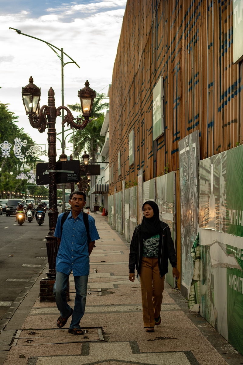 clothing, asphalt, 5K, indonesia, adult, day, males, tarmac, street lamp, outdoors, full length, surabaya, looking at camera, footpath, shoe, jl tunjungan
