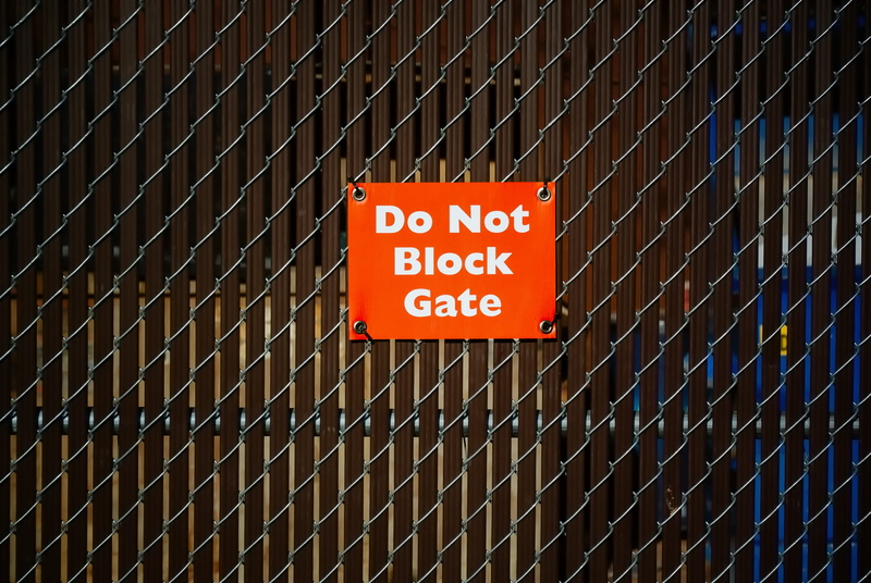wall, chainlink fence, pattern, board, communication, gate, text, wooden, safety, white, security, phoenix, alphabet, wildlife, sign, information, united states