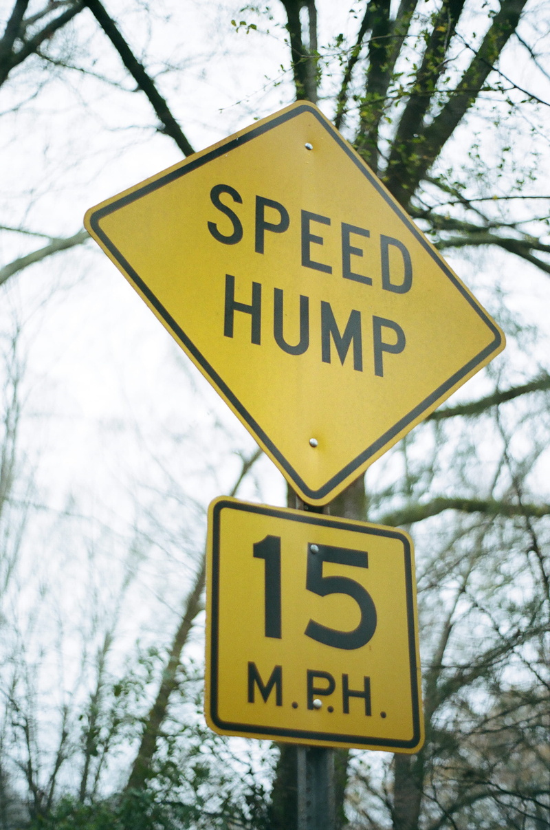 yellow, information, transportation, signage, sign, daytime, no people, focus on foreground, guidance, wire, star symbol, information sign, hump, mph, symbol