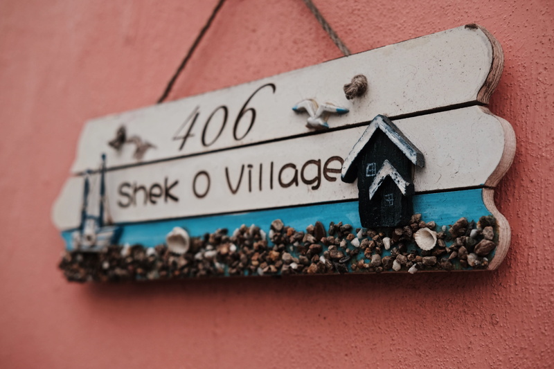 brick, word, shelf, indoors, bird feeder, clothing, symbol, paper, wood, black color, o, 5K, text, food and drink, selective focus, wall - building feature