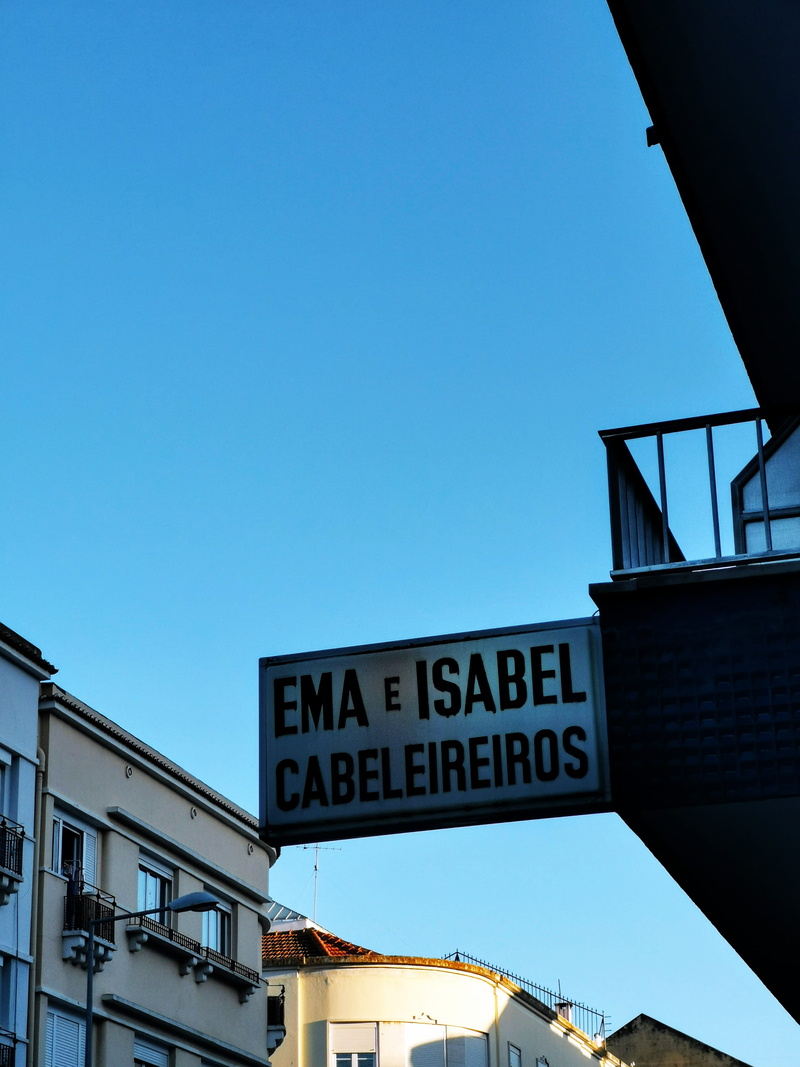 information sign, nature, clear sky, information, tower, window, guidance, building exterior, banister, copy space, sky, billboard, lisboa, spire, communication