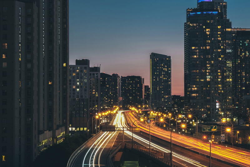 tall - high, transportation, office building exterior, taken, time, light, blue, architecture, sky, city, modern, cars, lapse, building, multiple lane highway