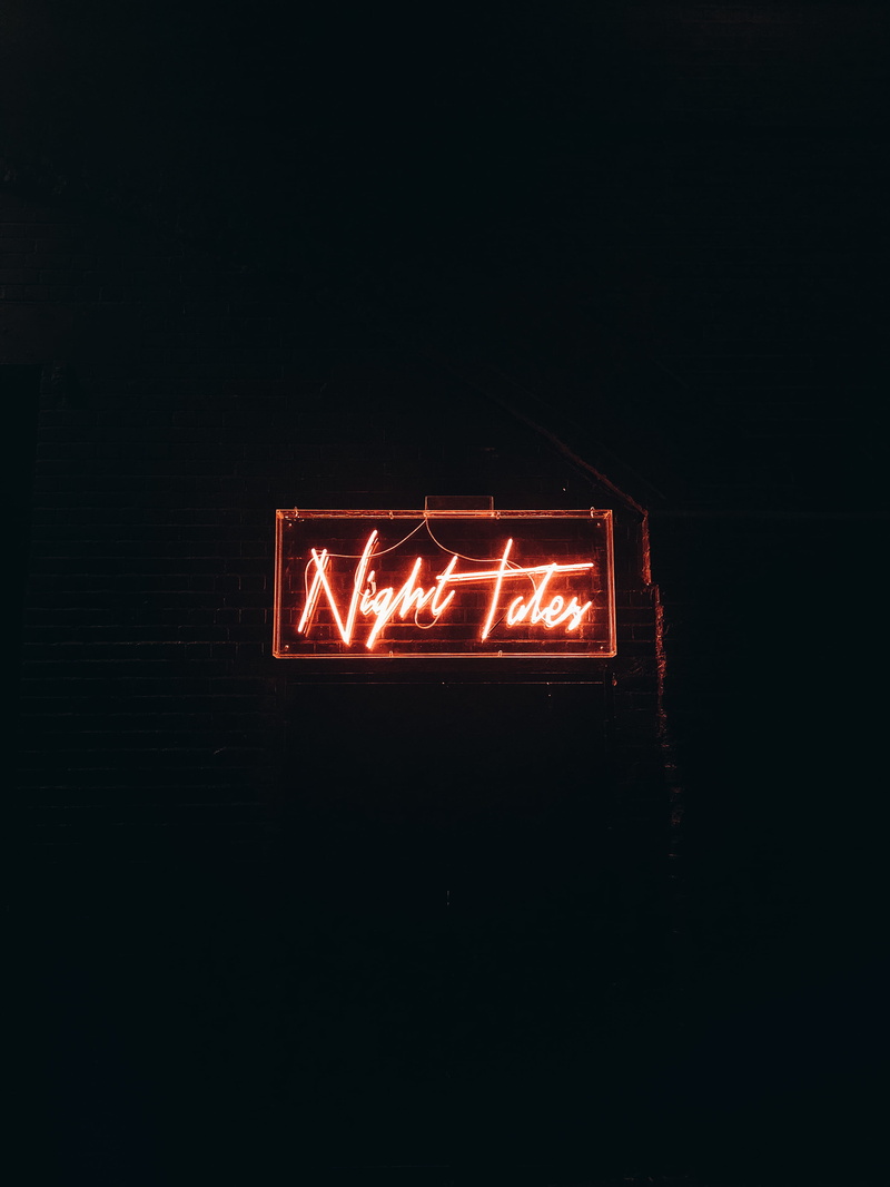 photo, text, communication, night, neon, design, evening, black background, red, arrow symbol, neon sign, sign, western script, signage, capital letter