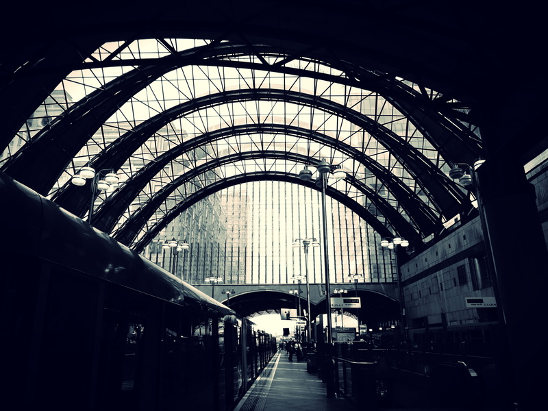 sunlight, subway system, built structure, light, mode of transportation, dark, buildings, outdoors, walking, black and-white, tunnel, railroad station