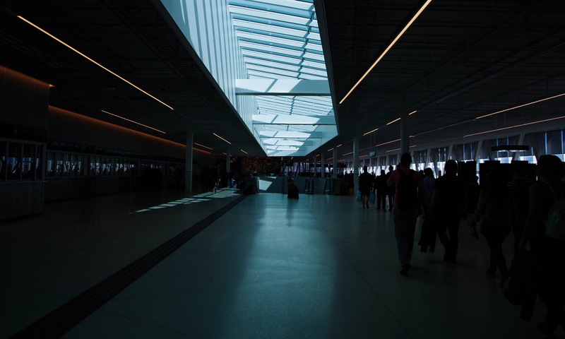 hallway, lifestyles, station, light, crowd, men, illuminated, the way forward, real people, large group of people, tunnel, city, reflection, leisure activity