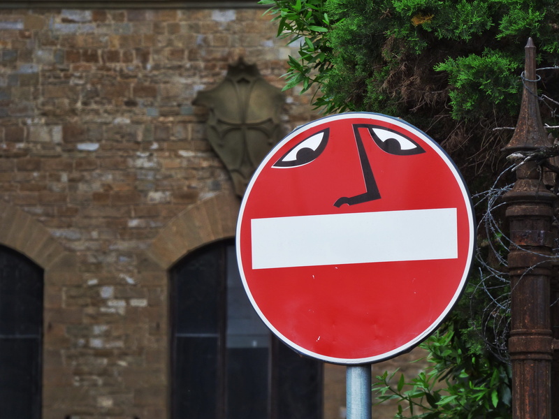 day, warning symbol, plant, wall - building feature, road sign, humorous, brick, circle, information sign, humour, funny, road, wall, sign, communication