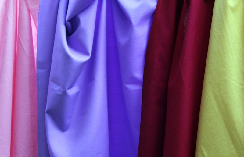 display, rainbow, thread, cloth, indoors, cotton, fabric, full frame, selection, textile industry, blue, stitch, retail, purple, clothing, material, hanging