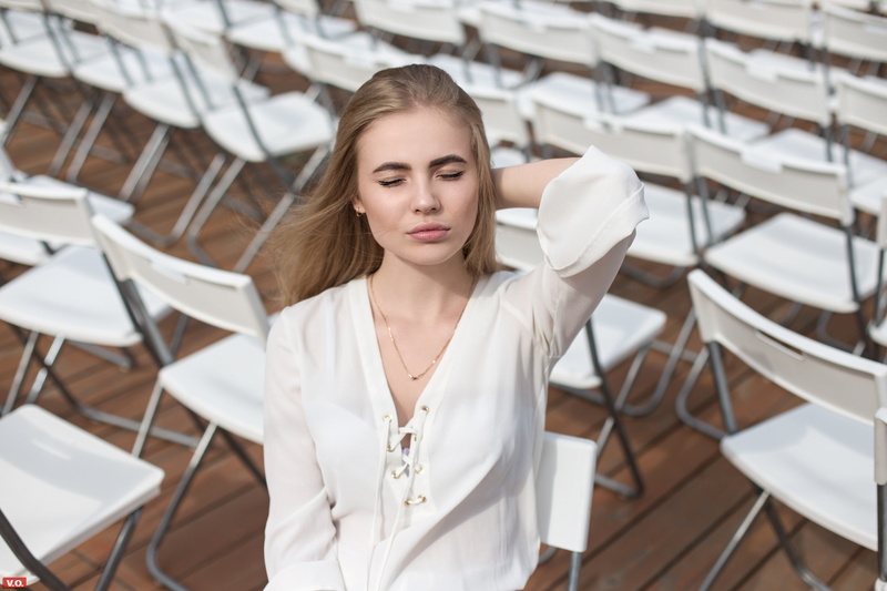 one person, beautiful woman, white color, hairstyle, women, fashion model, front view, contemplation, face, chair, adult, hair, blonde, beautiful people