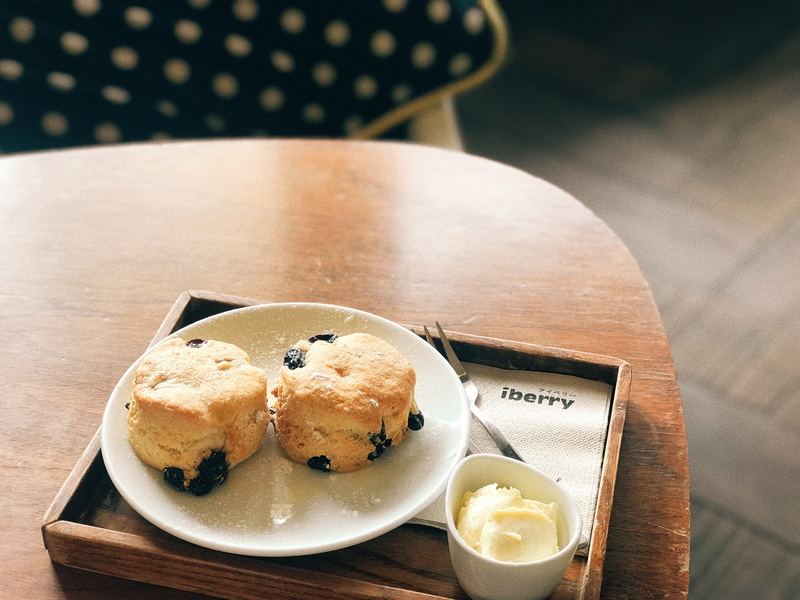 confectionery, serving size, plate, beside, dessert, pottery, butter, fruit, muffin, refreshment, temptation, wood - material, bun, food, raisins, jam