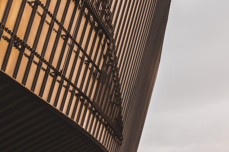 office building, staircase, no people, sky, day, steps and staircases, triangle, wall - building feature, arena, building exterior, high rise, city, railing