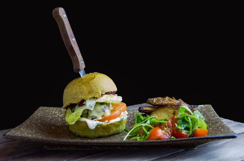 sandwich, indoors, herb, leaves, ceramic, 2K, no people, lettuce, top, healthy eating, bread, rectangular, brown, black background, plate, freshness, avocado