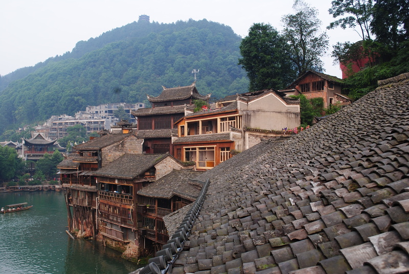 day, roof, outdoors, building exterior, mountain, ink, building, architecture, plant, water, no people, hunan, nature, built structure, tree, fenghuang