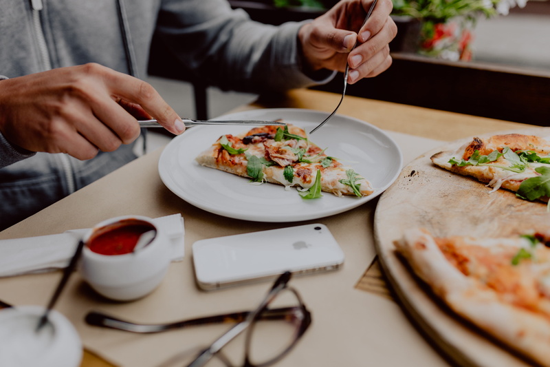 meal, food and drink, food, hand, pizza, business, freshness, plate, dinner, midsection, men, indoors, cozy, cheese, italian, table, restaurant, human hand