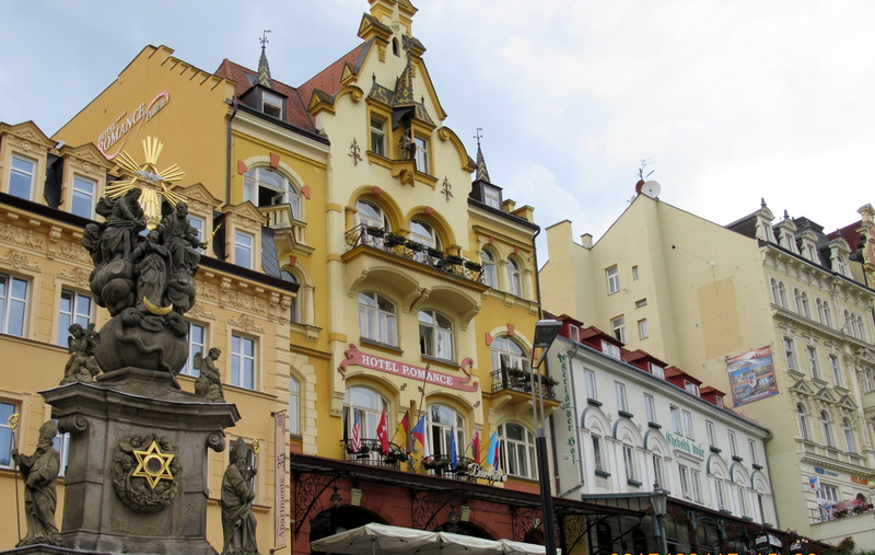 karlovy vary, built structure, sky, cloud - sky, residential district, building, day, human representation, low angle view, sculpture, hotels, nature, art and craft