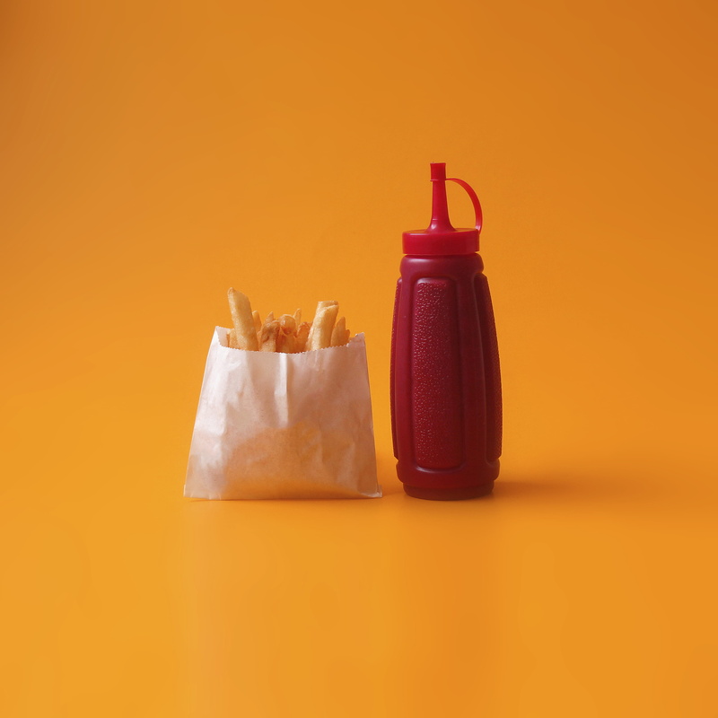 indoors, food and drink, bottle, plastic, squeeze, fried, cut out, take out food, close-up, copy space, white, orange background, container, beside, red