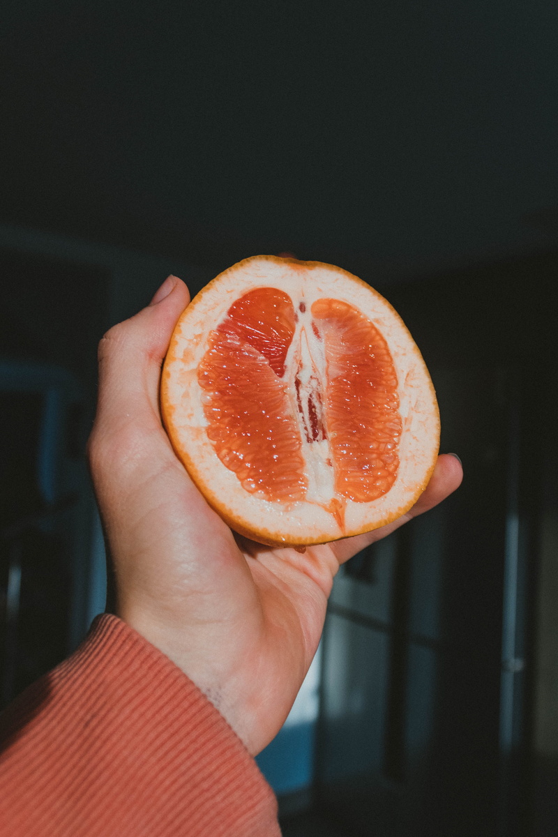 toronge, finger, human hand, unrecognizable person, body part, grapefruit, citrus fruit, indoors, hand, freshness, slice, wellbeing, person