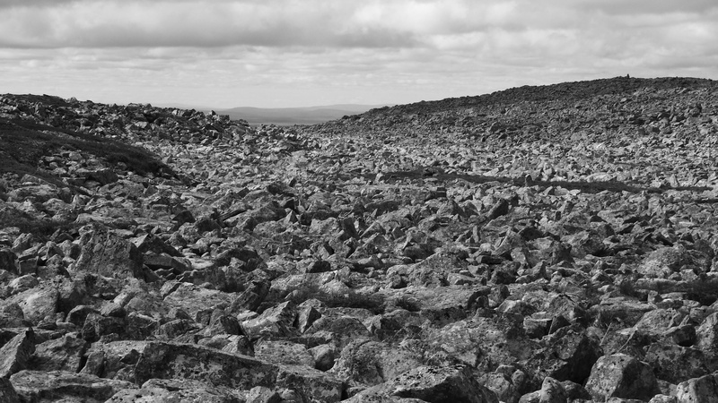 non-urban scene, rock - object, scenics - nature, screes, outdoors, physical geography, no people, cloud - sky, stone field, mountains, tranquility, dramatic landscape