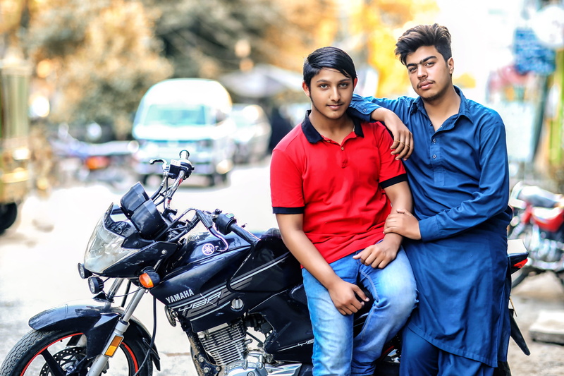 young men, golden sun, togetherness, casual clothing, two, transportation system, adult, blurred background, motorcycle, beautiful woman, pose, motorcycles