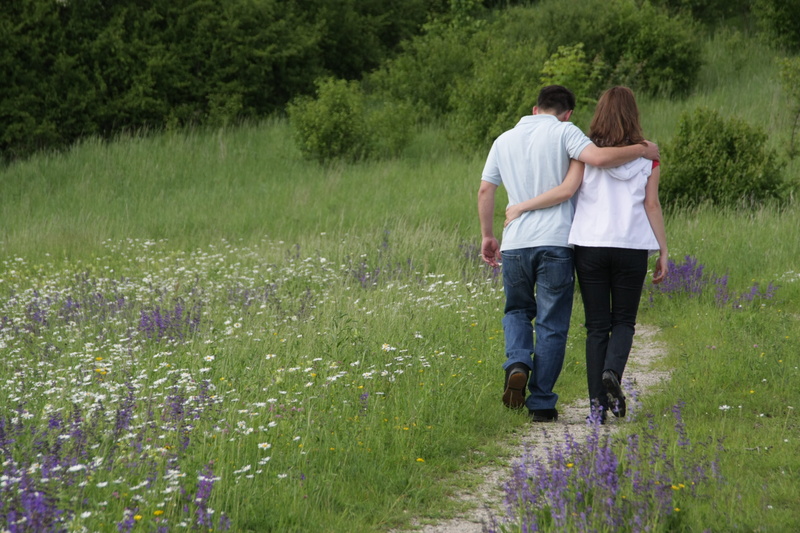 male, man in gray, couple, flowering plant, together, embracing, flower, female, men, outdoors, couple in love, woman, casual clothing, love, relationship