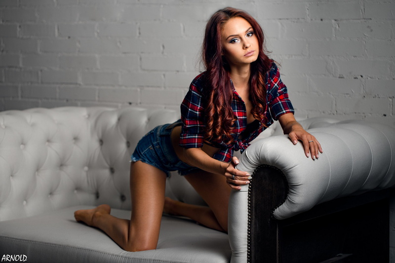 couch, hair, front view, fashion, casual clothing, looking at camera, dyed hair, beauty, hairstyle, plaid shirt, jean shorts, lifestyles, portrait, women