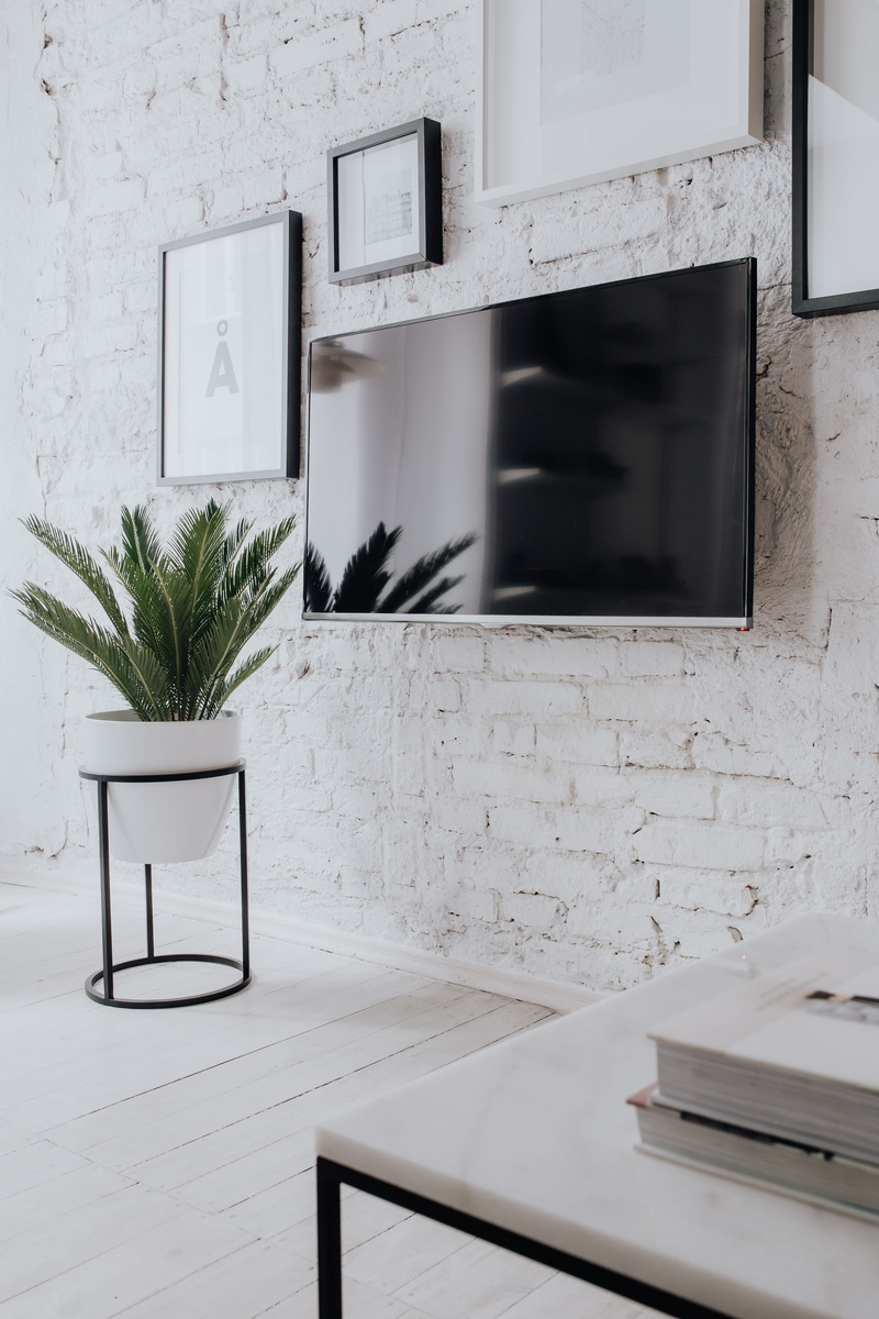 room, architecture, window, minimal, interior, white floor, Uncommon, coffee table, living, white walls, chair, houseplant, brick wall, built structure