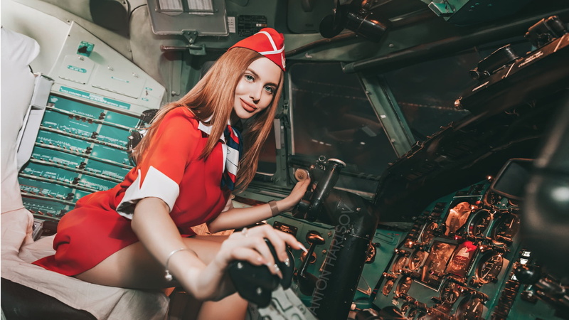 women, cockpit, red dress, 1080P, red, smiling, Anton Harisov, brunette, stewardess, sitting, portrait, planes