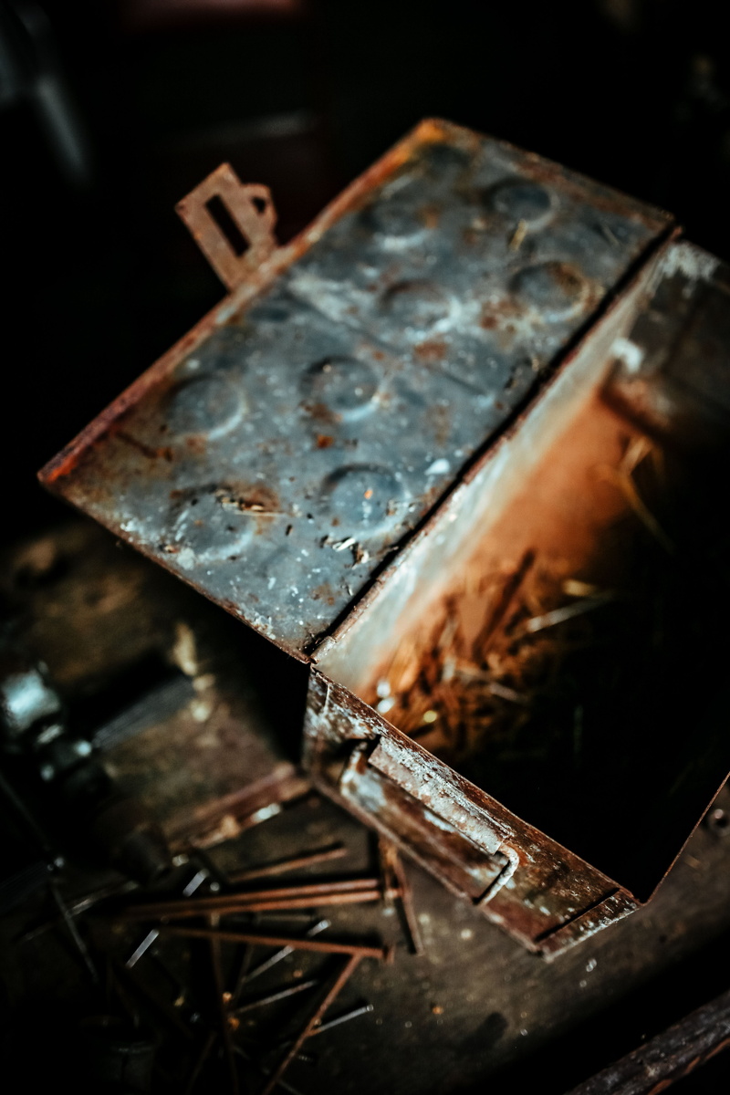 obsolete, selective focus, nature, glass, close-up, black background, Old, 5K, dirty, boxes, still life, nails, indoors, dust, antique, retro Styled, workshop