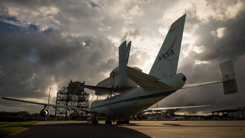 tool, space shuttle, air vehicle, sky, stationary, travel, black, aircraft, no people, day, cloud - sky, aerospace industry, plane, vehicle, sunset, transportation