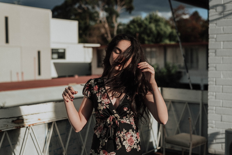 fashion, cap, beside, outdoors, architecture, woman, near, built structure, black hair, one person, handrail, building exterior, wearing, black, brown hair