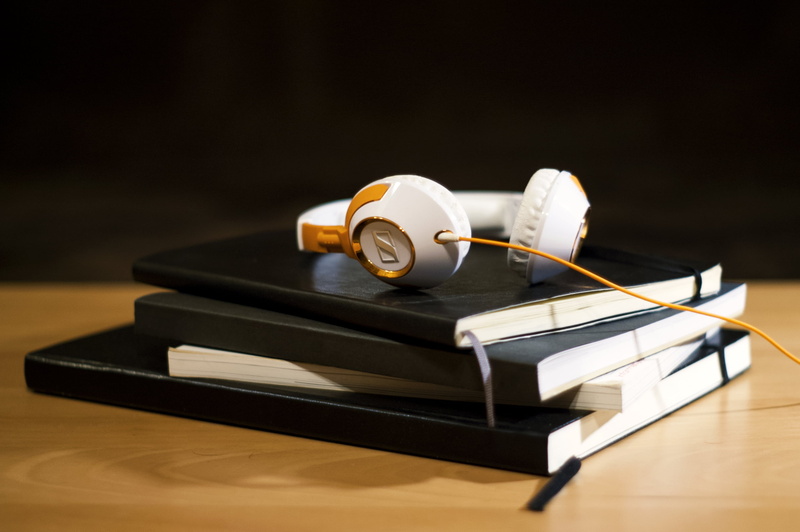 old-fashioned, surface, corded, rolled up, focus on foreground, white, table, stackable, background, day, sennheiser, black, medium group of objects, still life