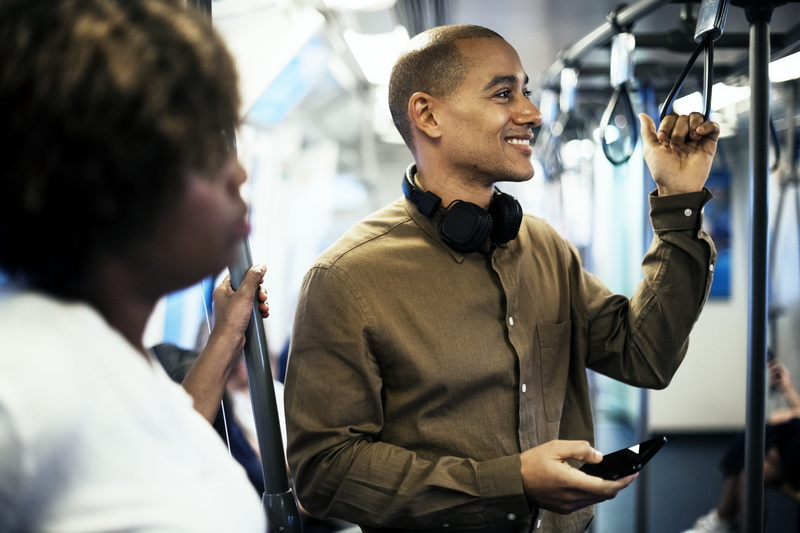 grip, men, working, headphones, portrait, young adult, talking, smile, holding, train, standing, smiling, wireless technology, black man, waist up, man