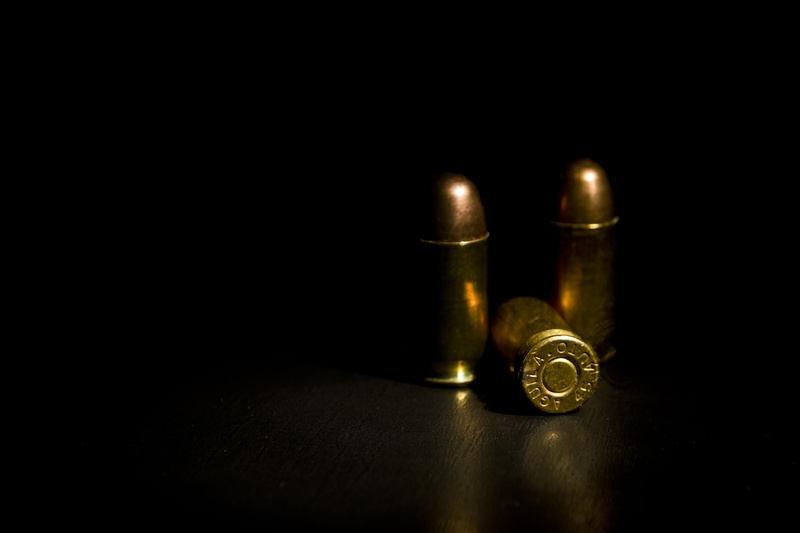 goddamn 45, copy space, studio shot, acp, floor, metal, muntition, close-up, black background, 5K, shoot, bullet, bullets, ball, table, indoors, warning sign