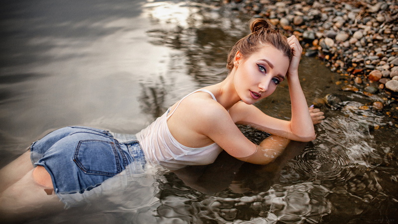 looking at viewer, 1080P, wet clothing, women outdoors, jean shorts, wet hair, women, river, eyeliner, wet body