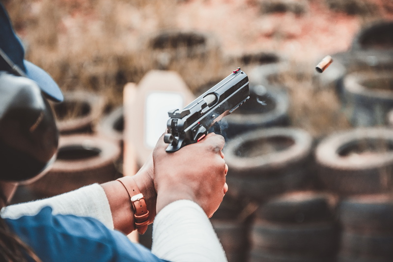 bullet, ammo, blur, Pistol, handgun, human hand, person, target shooting, holding, armed, focus, aiming, aggression, shooting, crime, social issues, day