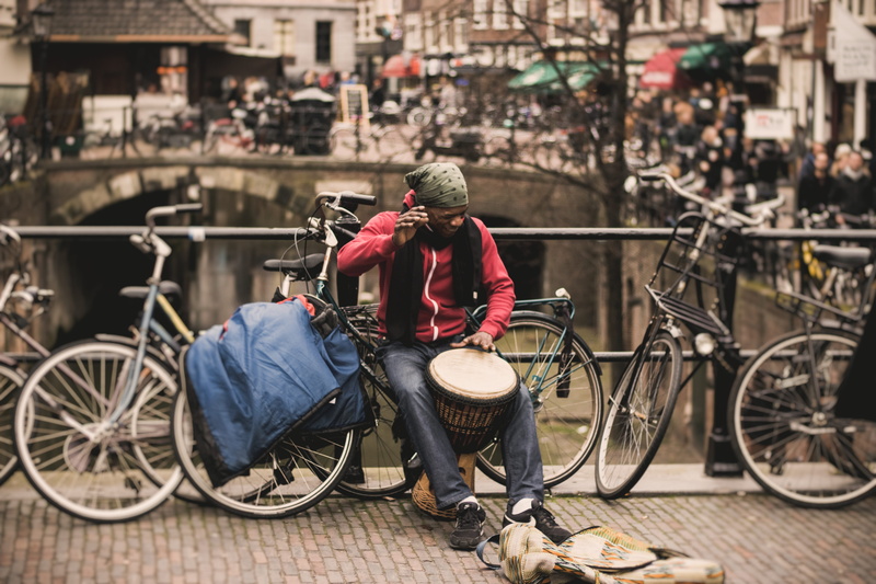 transportation, busking, one person, man, adults only, sitting, people, land vehicle, building exterior, musician, built structure, 5K, bridge, focus on foreground