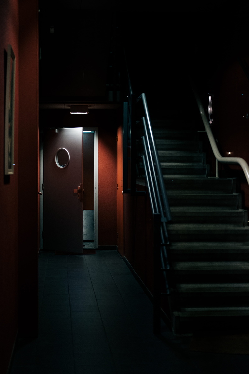 closed, the way forward, crypt, corridor, direction, empty, architecture, illuminated, banister, railing, no people, lighting, flooring, door, red, open door