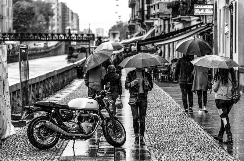 bridge - man made structure, protection, adult, outdoors, real people, beside, street, walking, motorcycke, mode of transportation, cafe, motorbike, architecture