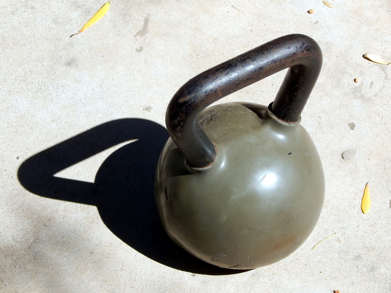 black color, weighing, weights, high angle view, sign, health, no people, fitness, security, exercise, food and drink, safety, kilogram, sunlight, nature