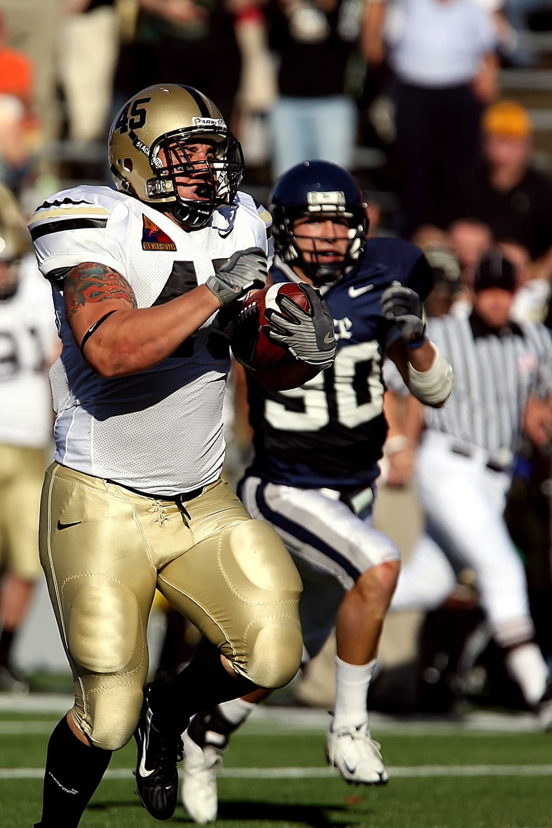 football, headwear, action, american football player, powerful, sports official, player, sport, uniform, competition, team, group of people, men, ball
