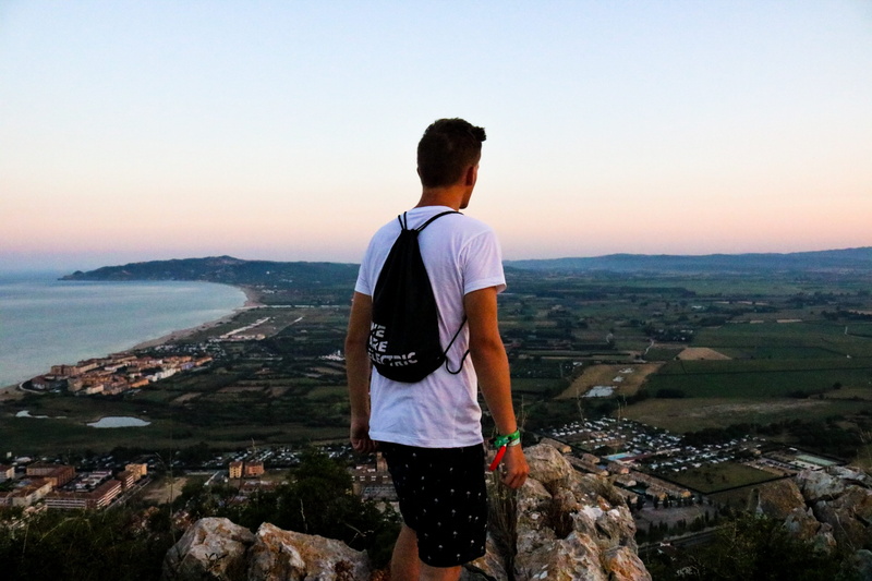 drawstring, real people, hike, backpack, standing, rear view, lifestyles, building exterior, architecture, young adult, looking at view, mountain, scenics - nature