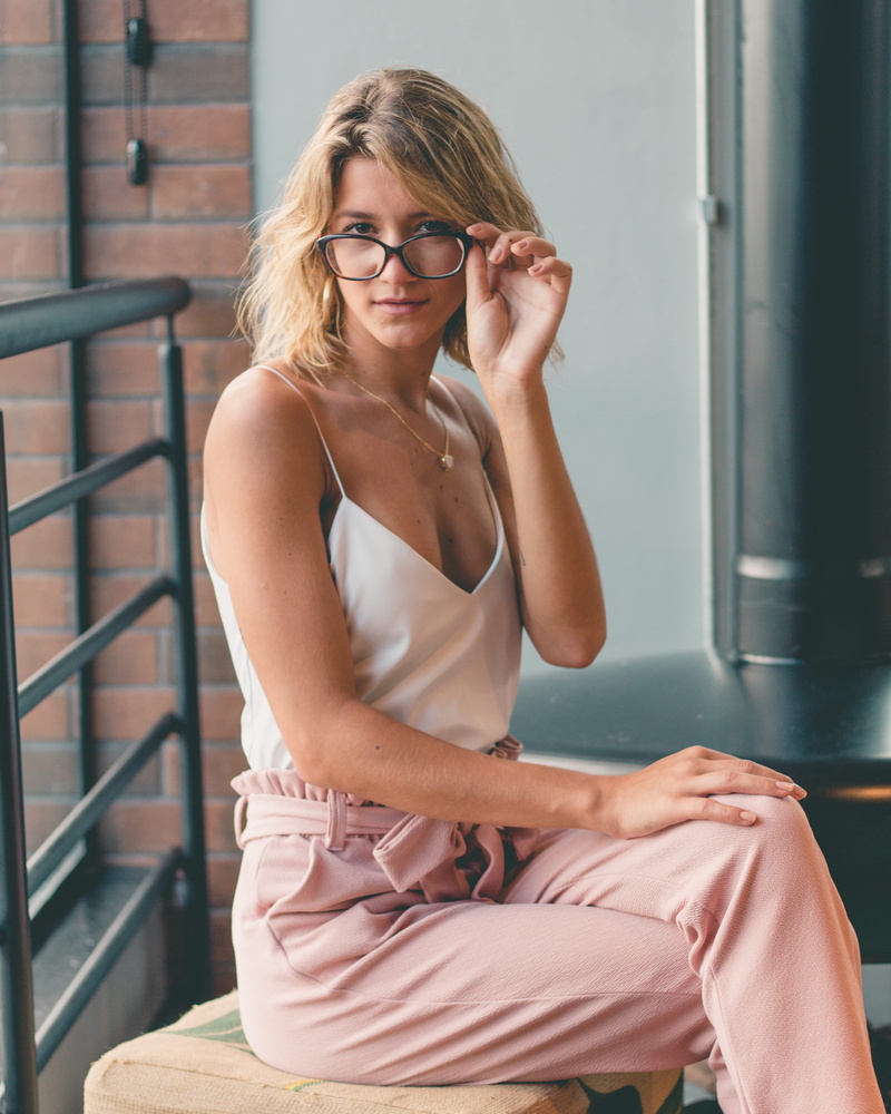 colored, women, indoors, young women, adult, eyeglasses, drawstring, leisure activity, white, looking at camera, lifestyles, neck, fashion, blond hair