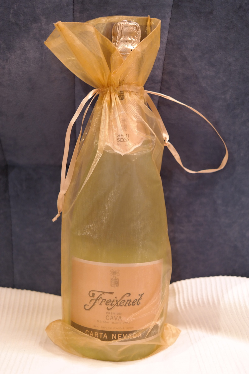 brown, bottle, no people, text, new year champagne, alcohol, western script, drink, bottle of sparkling wine, pouch, tied up, unopened, jar, closed, freixenet