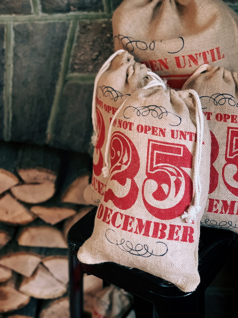 holiday, bag, log, one person, stacked, human body part, christmas, human, close-up, real people, person, text, december, lifestyles, love, message, present