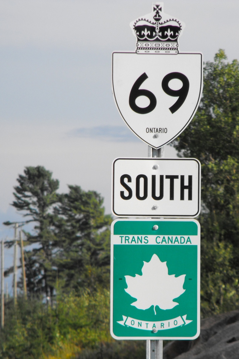 day, focus on foreground, ontario, direction, no people, landmark, plant, representation, road, text, highway, directional sign, road Sign, guidance, sky
