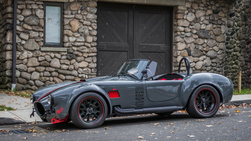 transportation, stone wall, land vehicle, wheel, sports car, architecture, outdoors, luxury, AC Shelby Cobra, day, 4K, vintage, retro styled, garage, no people