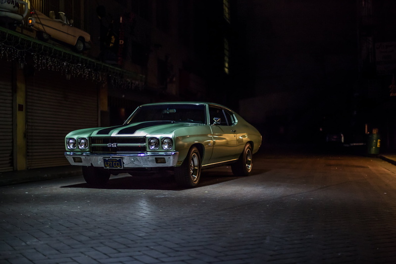 city, yard, vintage car, building exterior, incidental people, night, mode of transportation, garage, luxury, green, retro styled, Chevrolet, Chevelle
