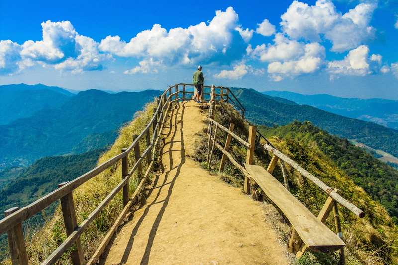 tranquil scene, extreme, architecture, land, forest, woods, day, high, hill, mountain range, sight, bench, person, hike, man, scenery, fence, photo, cloud - sky