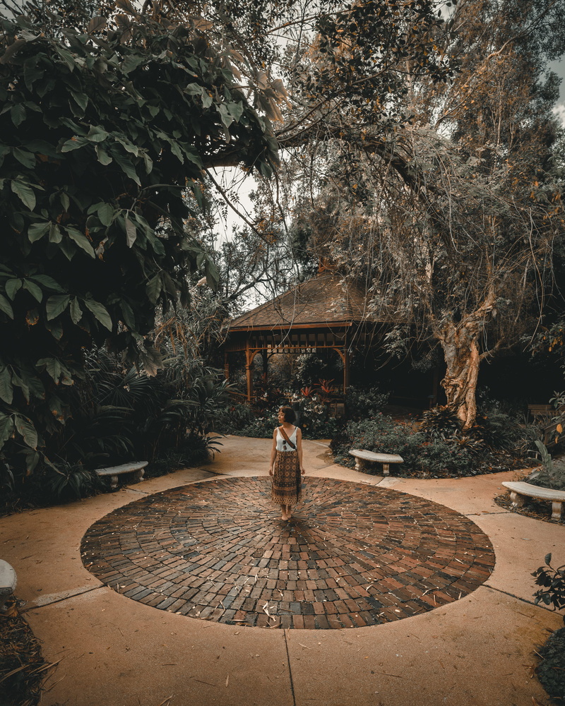 architecture, day, woman, benches, daytime, adult, outdoors, growth, leisure activity, nature, sitting, skirt, empty, standing, one person, full length