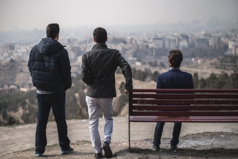 togetherness, outdoors, seat, men, arm around, bench, standing, couple - relationship, iran, adult, rear view, leisure activity, love, architecture, day