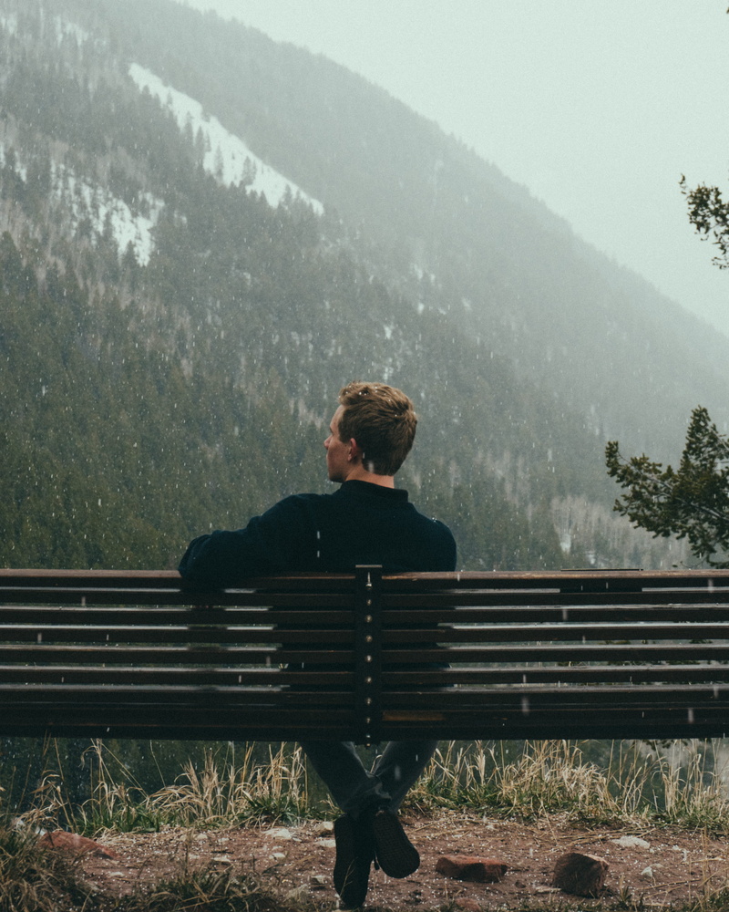 young adult, united states, portrait, rain, sitting, casual clothing, young men, one person, cold, snow, plant, clouds, trees, nature, outdoors, bench